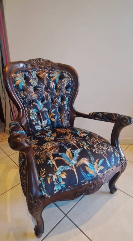 Wingback armchair reupholstered in a bold floral fabric