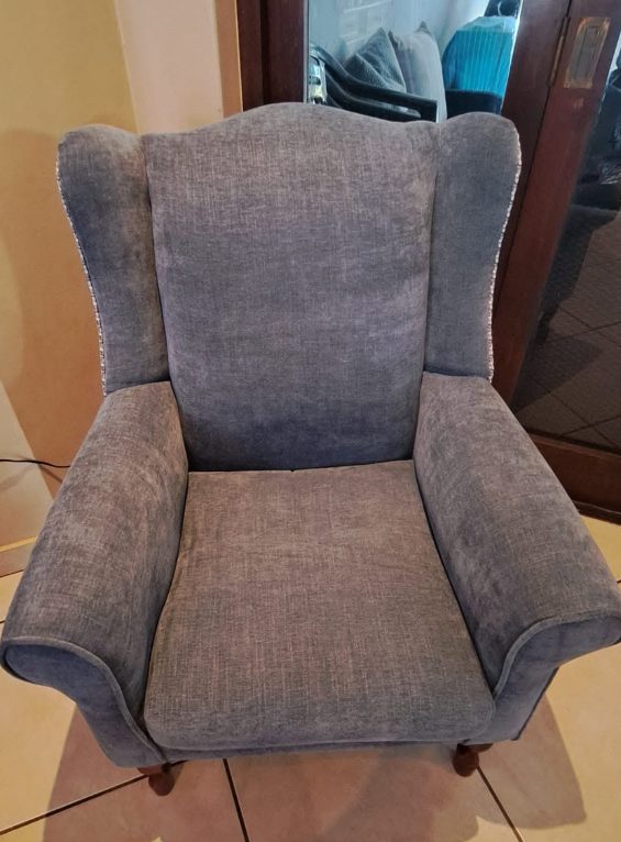 Reupholstered wingback chair in grey linen
